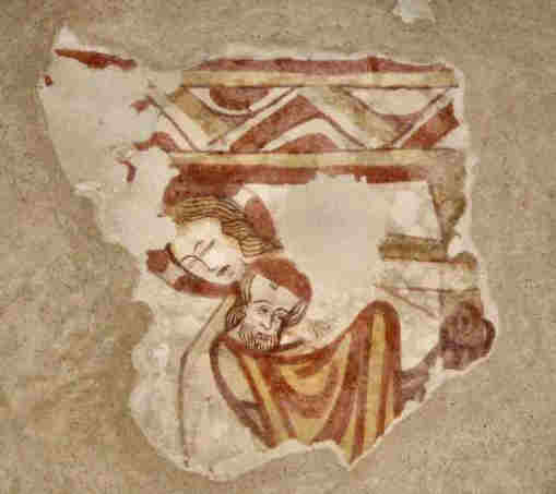 Le Christ et Joseph d'Arimathie. La tête du Christ est plus grosse que celle de Joseph et tous deux ont de longs cheveux blonds et ondulés. Par respect, Joseph cache ses mains sous son manteau. Le Christ a un visage d'une beauté inhabituelle.